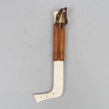 Oskar Tjäder, A reindeer horn knife, signed.