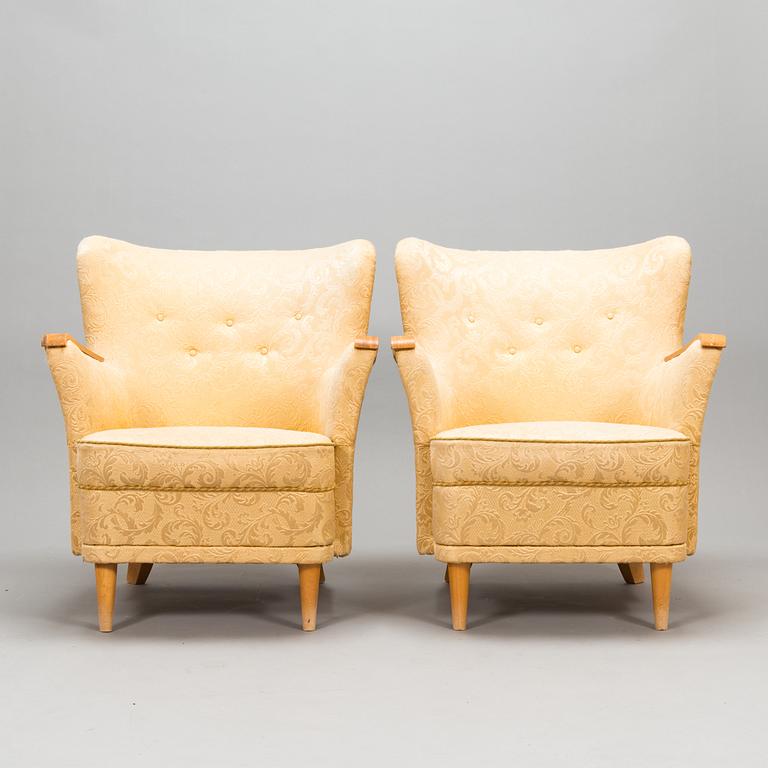A pair of 1950's armchairs.