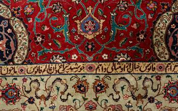 A carpet, semi-antique Tabriz, signed ca 335,5 x 256,5 - 261,5 cm.