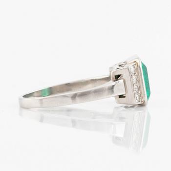 Platinum and emerald and eight cut diamond ring.