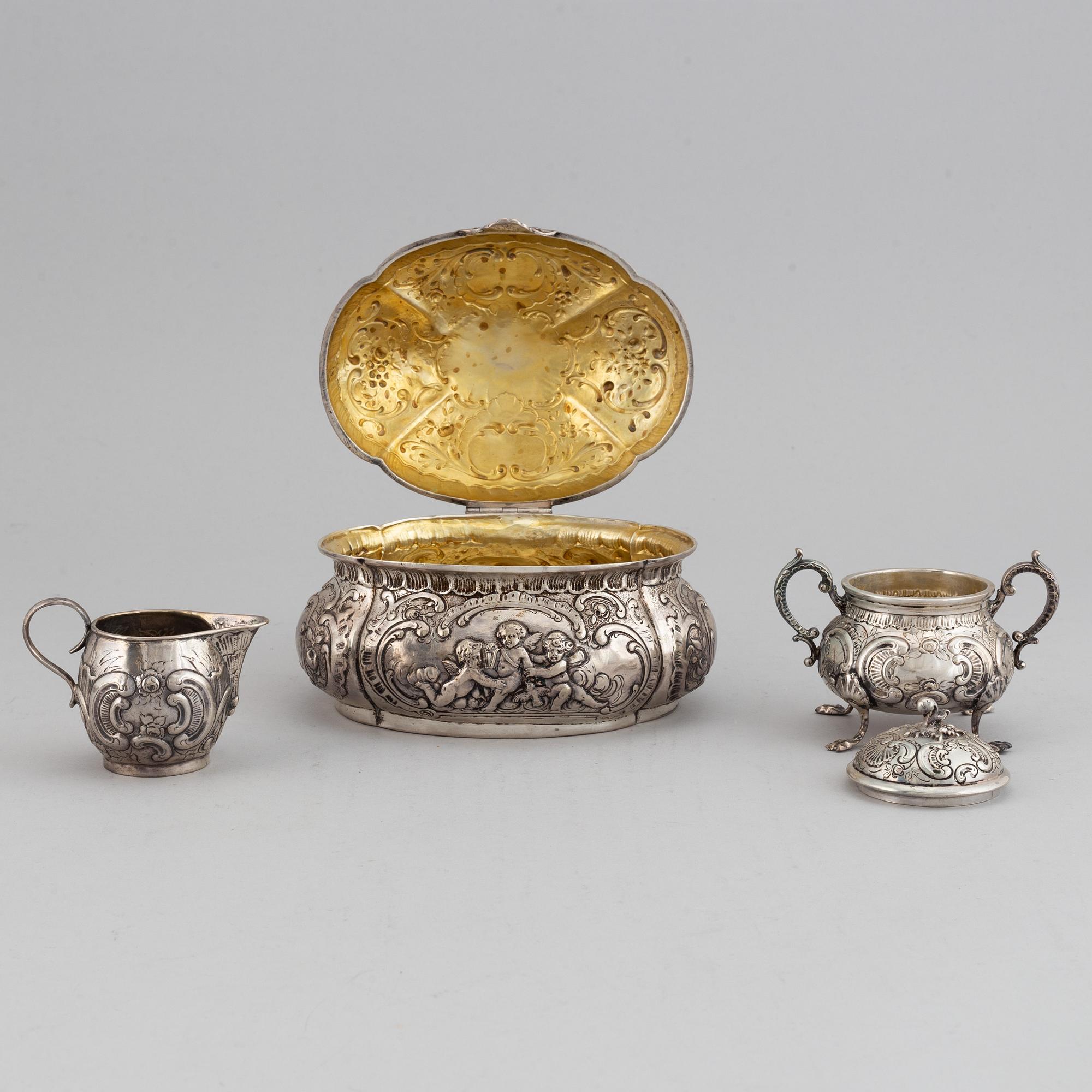 A german silver 800 sugar box, creamer and sugar bowl.