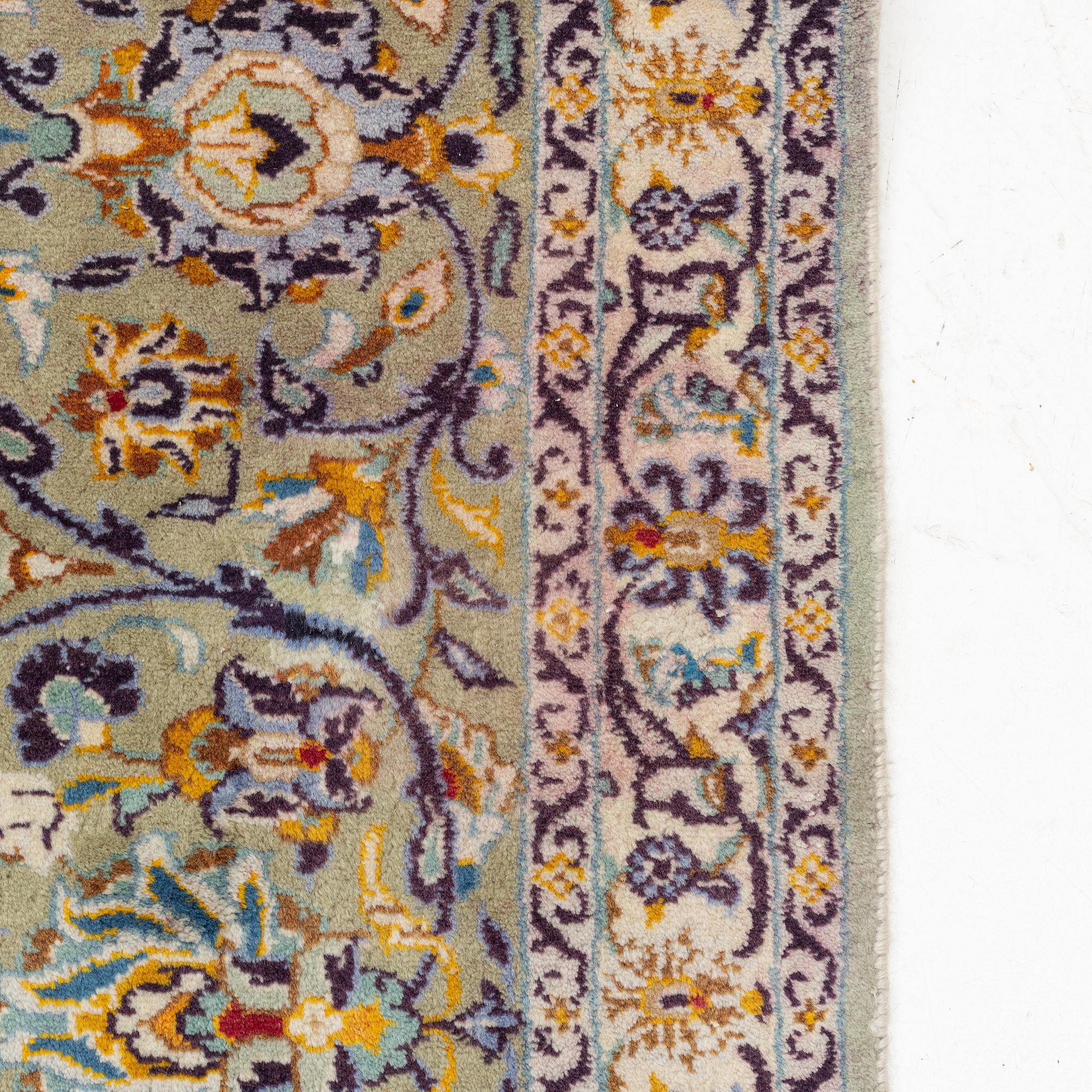 A Keshan carpet, signed, c. 410 x 297 cm.