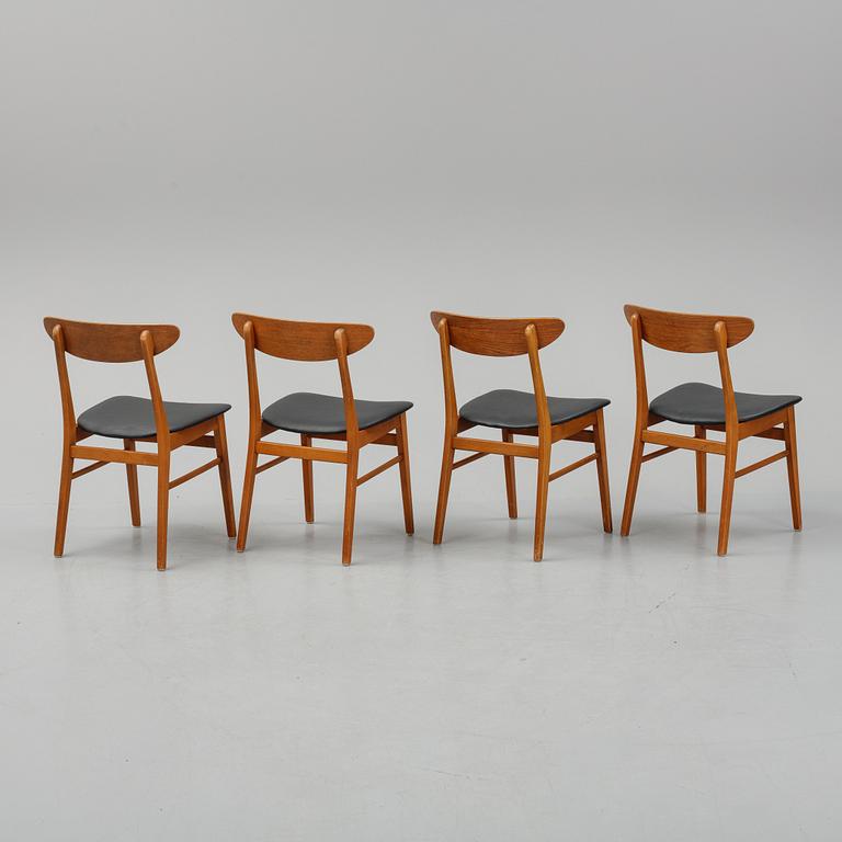 A teak dining table with 4 'Monaco' chairs, mid 20th century.