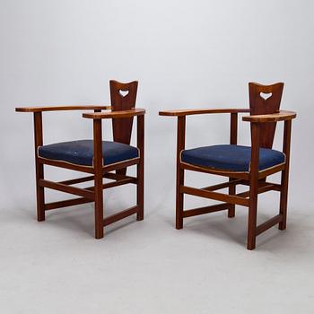 A pair of Arts and Crafts armchairs, early 20th century.