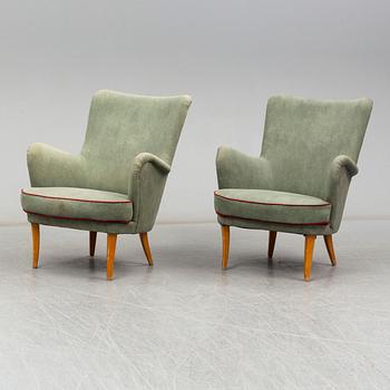 A pair of Swedish easy chairs, mid 20th Century.