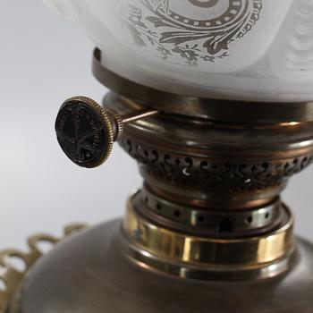 Two floor parafine lamps, 20th century.