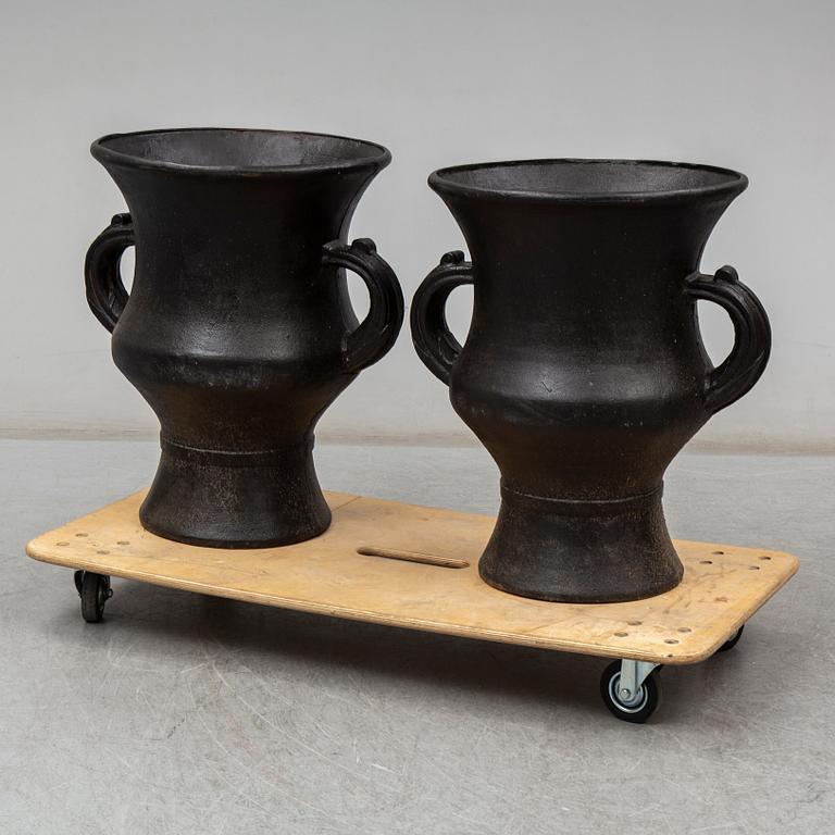 A pair of cast iron garden vases, 20th Century.