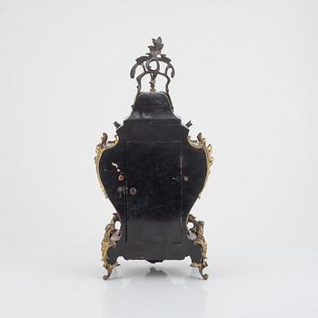 A Louis XV-style 'faux tortoise' and gilt brass-mounted striking mantel clock, late 19th century.