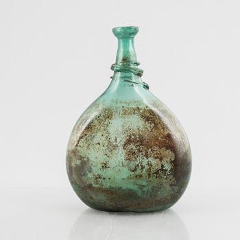 A turquoise tinted glass bottle, 19th century.