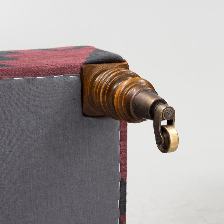 A Howard style easy chair with av footstool, 21st Century.