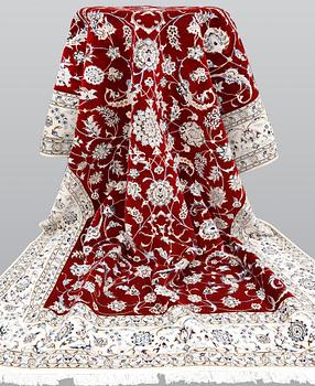 A Nain part silk carpet, 302 x 204 cm.