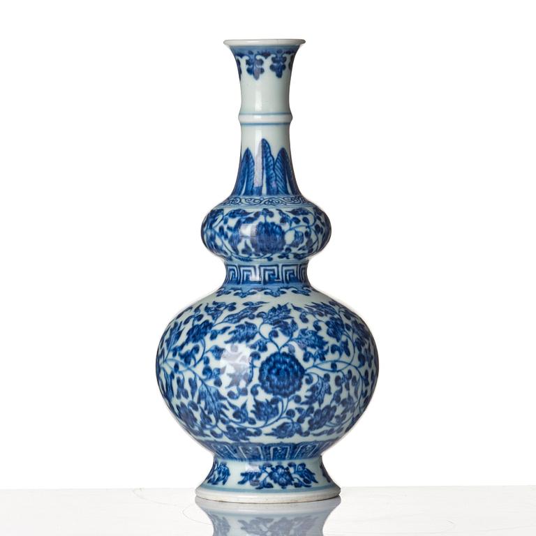A blue and white gourd shaped lotus vase, presumably Chinese Republic with Qianlong mark.