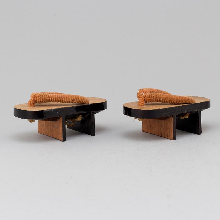 A pair of Japanese 'Geta' shows and two Chinese pouches, early 20th century.