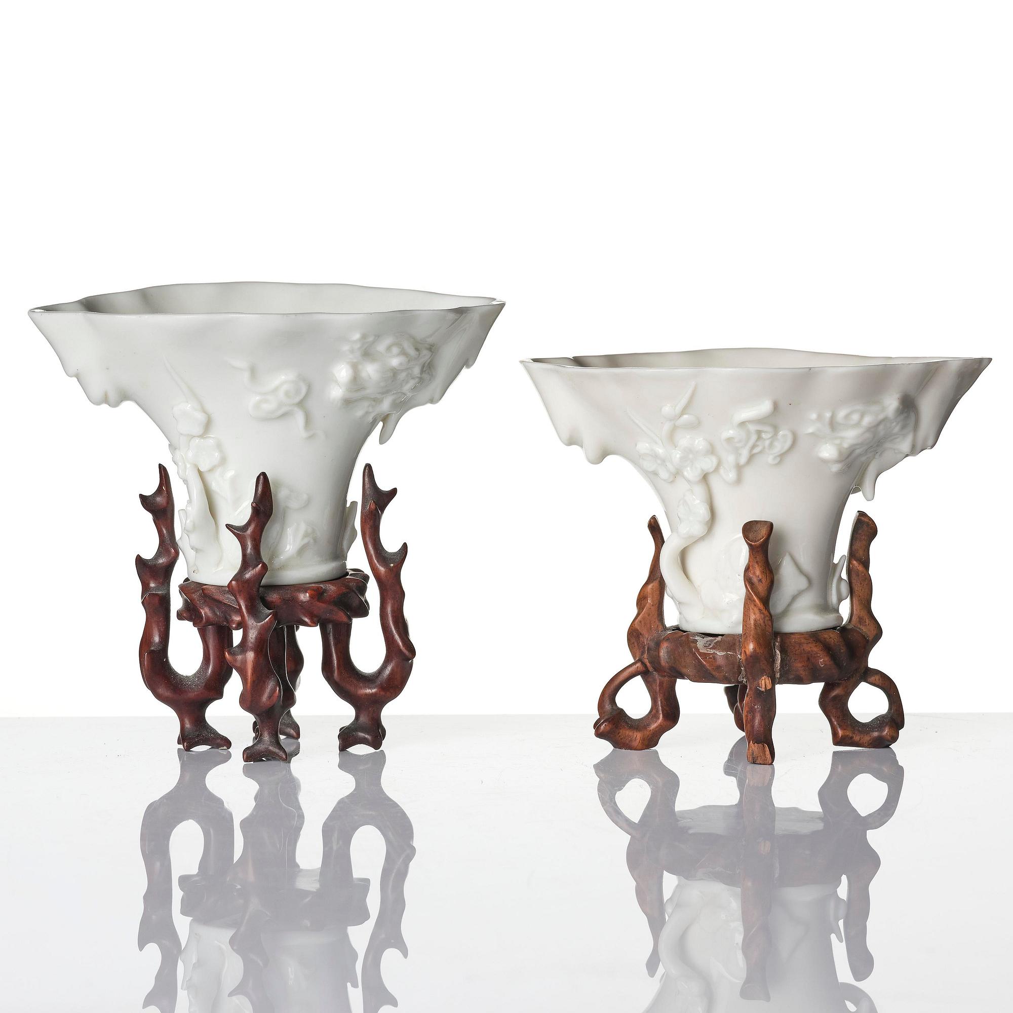 A pair of blanc de chine rhinoceros libation cups, Qing dynasty, Kangxi (1662-1722).