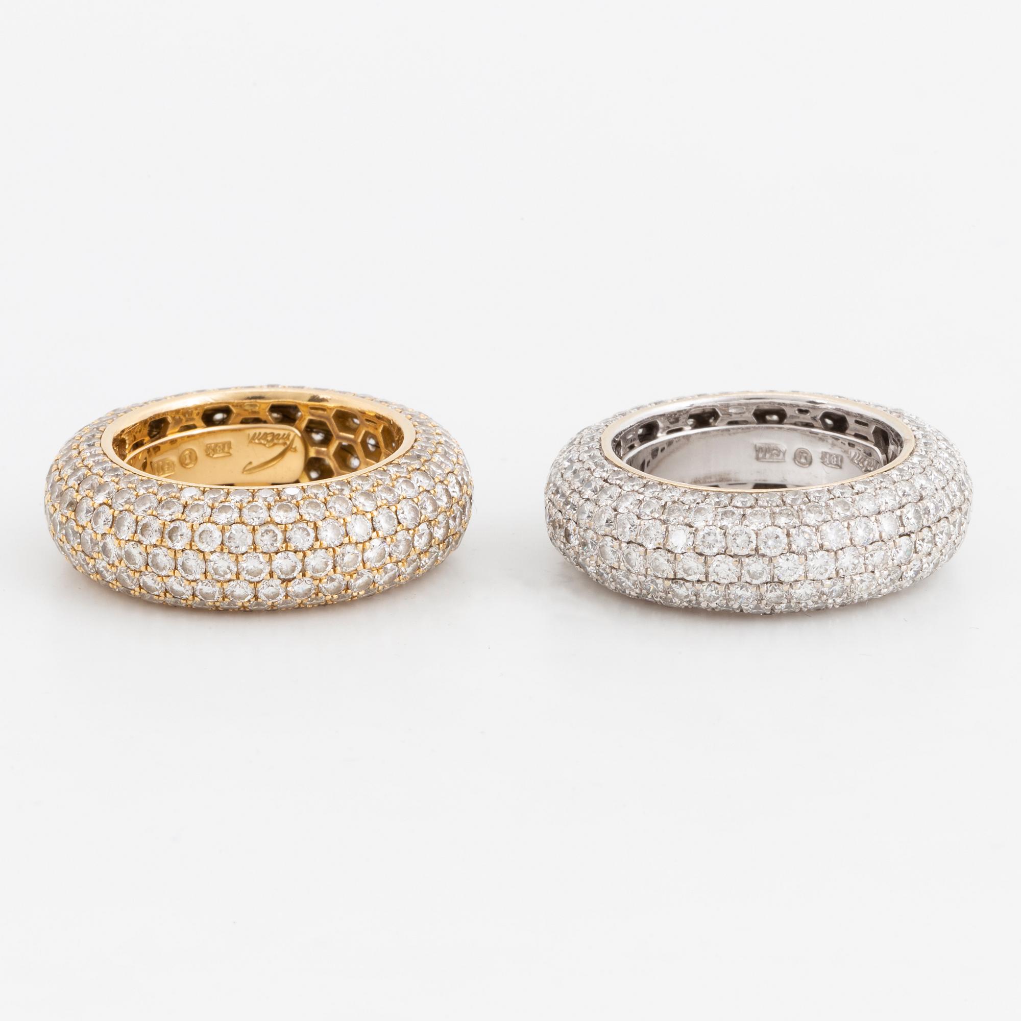 Two brilliant-cut diamond rings.