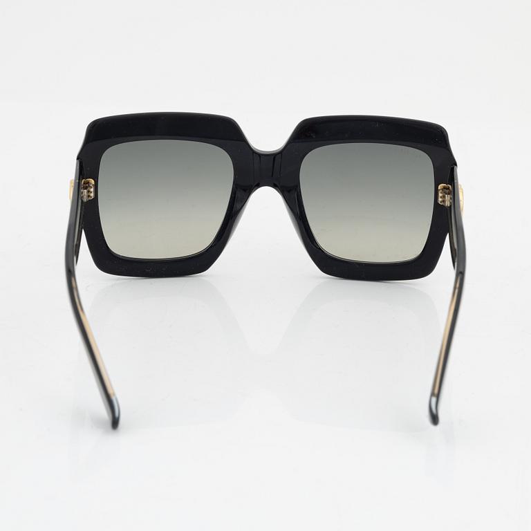 Gucci, a pair of black plastic and rhinestone sunglasses.