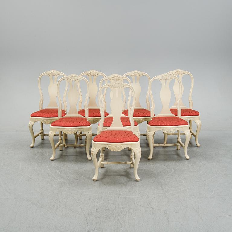 A rococo style dining set with a around table and eight chairs, 20th Century.