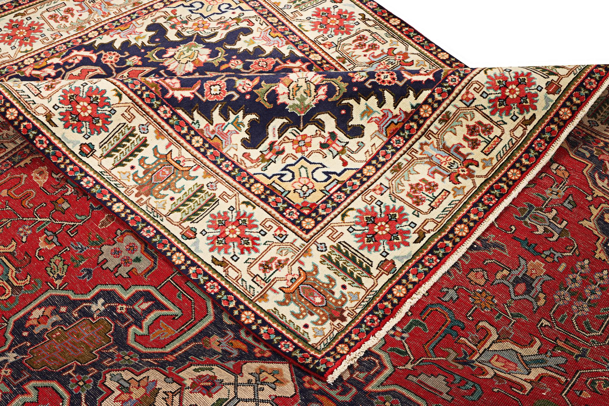 A Tabriz carpet, c. 335 x 257 cm.