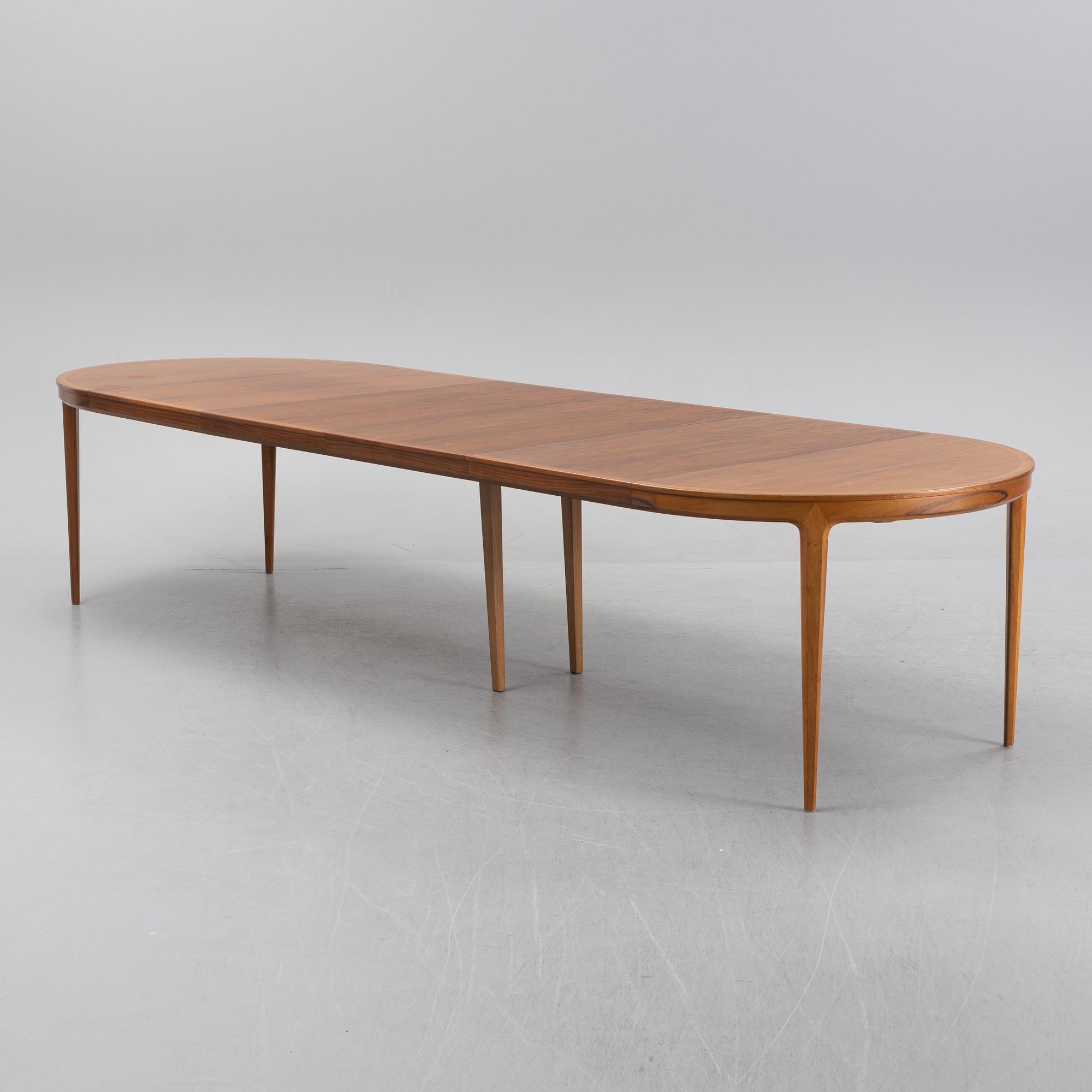Bertil Fridhagen, a 'Diamant' walnut veneered dining table, with four additional leaves.  Bodafors.