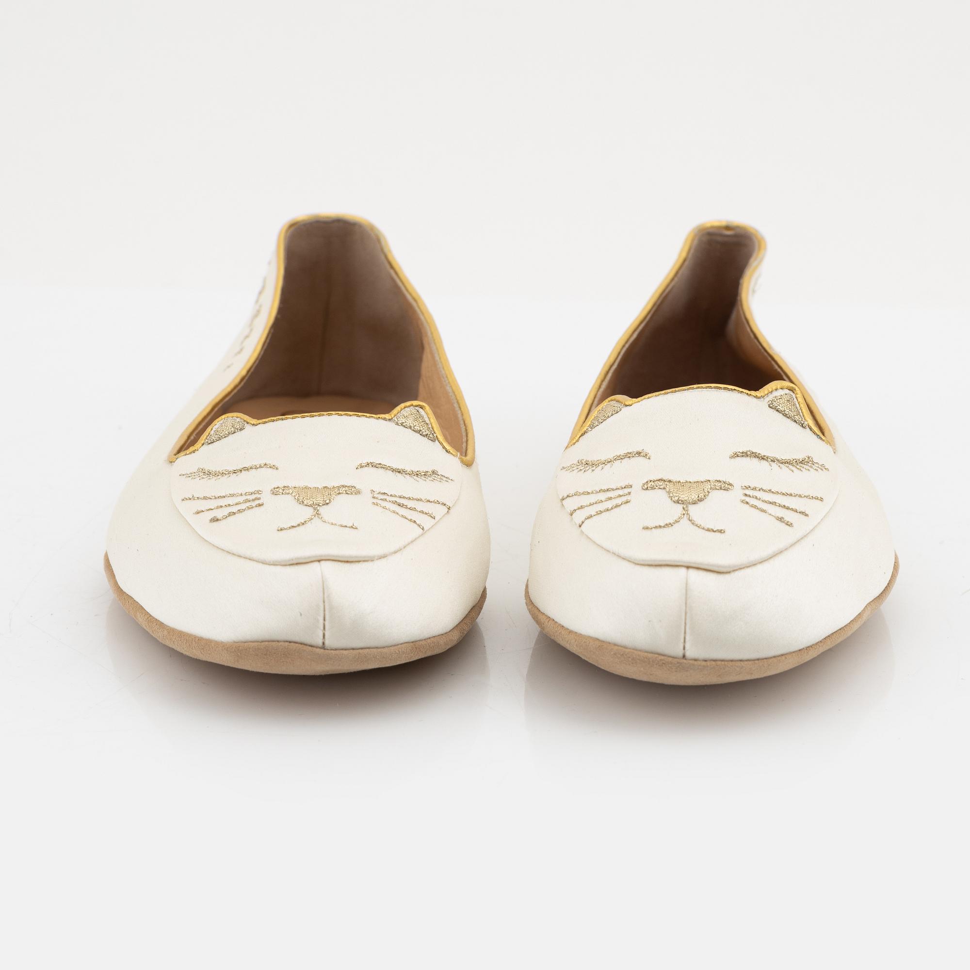 Charlotte Olympia, a pair of 'Cat nap' silk flats, a sleeping mask and a toilet bag, size S.