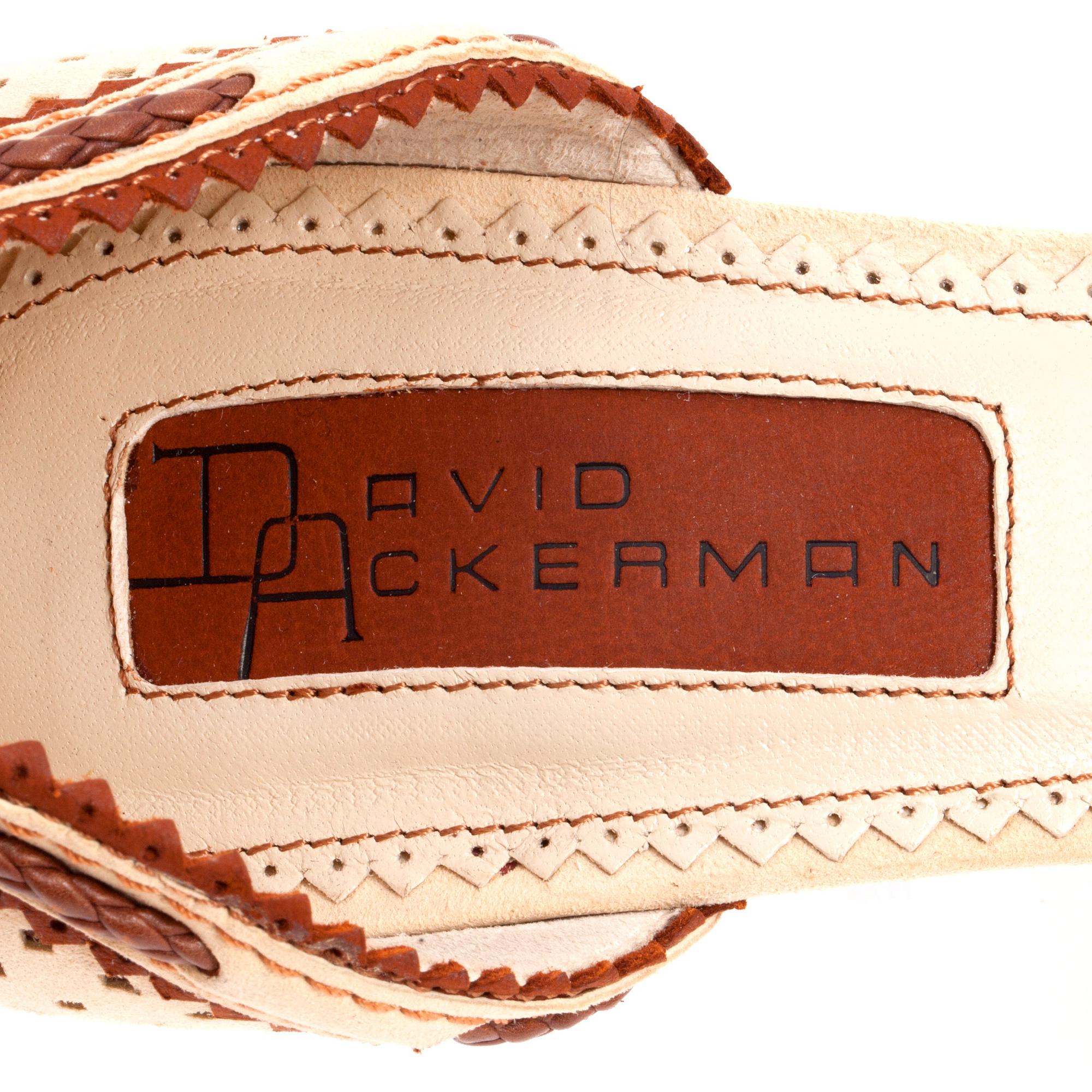 DAVID ACKERMAN, a pair of beige and brown pumps. Size 38.