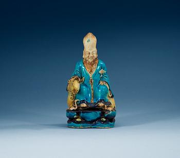 1458. A turquoise-glazed porcelain figure of Shoulao, 17th Century.