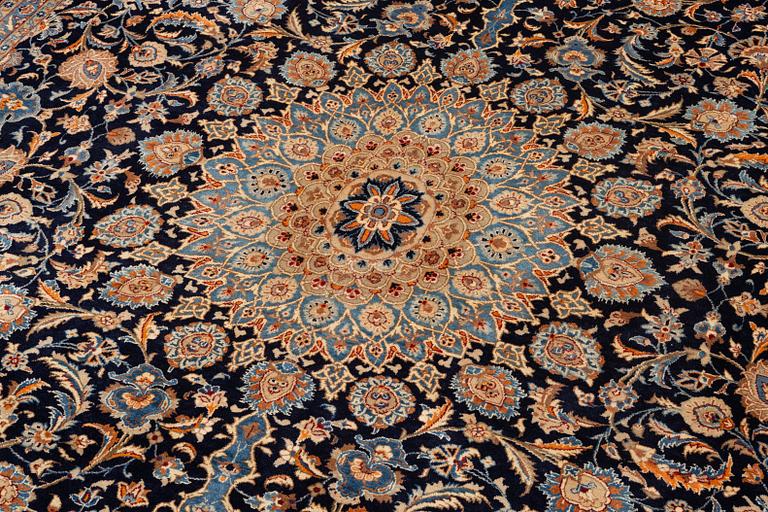 A Keshan rug, approx. 370 x 297 cm.