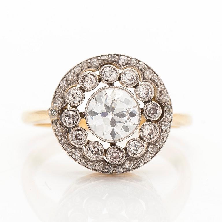 An 18K gold ring, set with old- and single-cut diamonds.