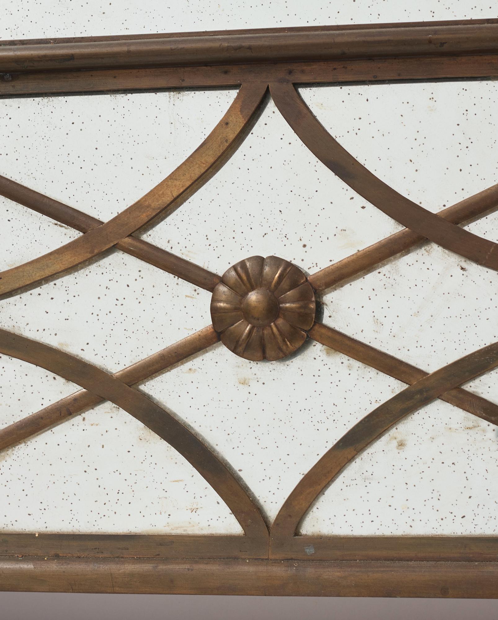 Swedish Grace, a brass framed wall mirror, 1920-30s.