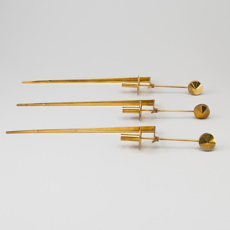 PIERRE FORSSELL, three 'Pendel' brass wall sconces from Skultuna, 1986-91.