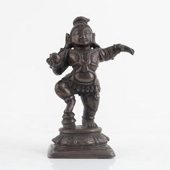 A small bronze figure of Krishna, Southern India, 16th/ 17th century.