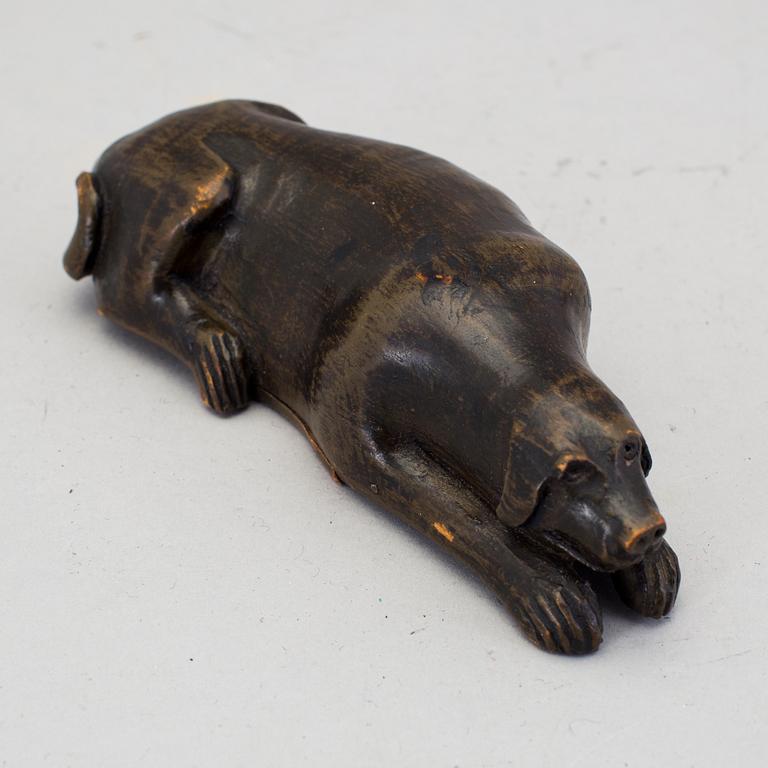 A 19th century snuff box in the shape of a dog.