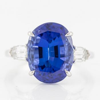 Ring, Fred Leighton platinum with an oval faceted tanzanite and fancy-cut diamonds.