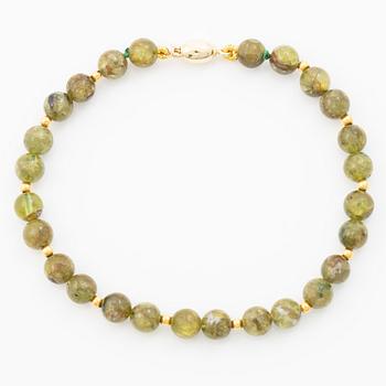 Armband 18K guld med peridotkulor, Italien.