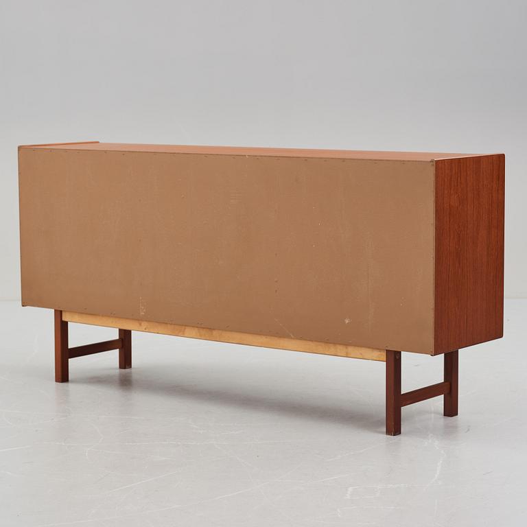 A late 20th Century teak veneered sideboard.