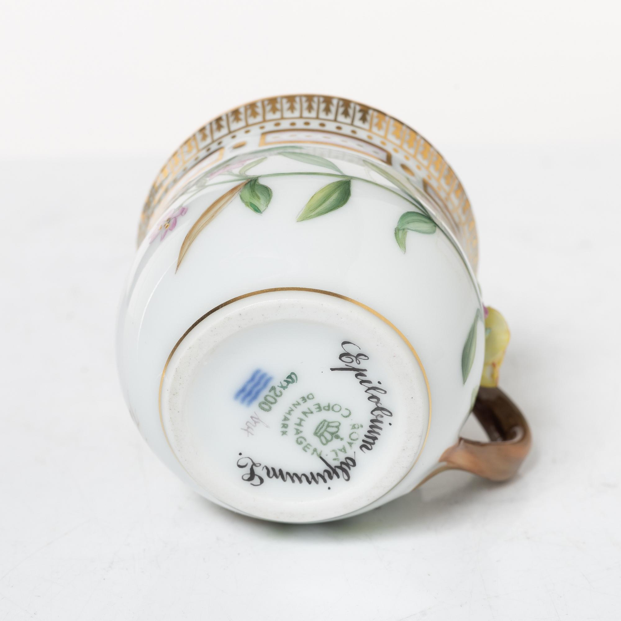 Royal Copenhagen, cream jug with lid and saucer, as well as coffee cup with saucer, porcelain, Flora Danica, Denmark.