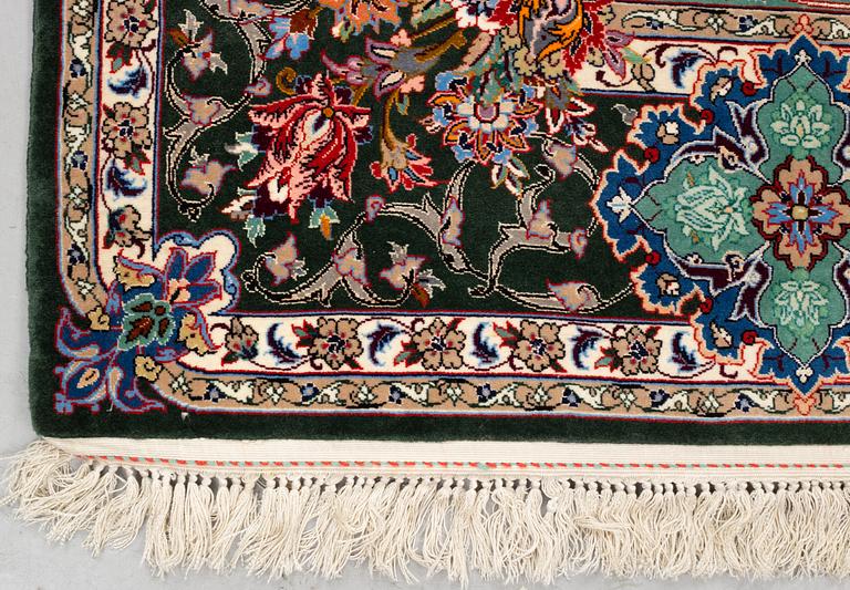 A rug, old Esfahan, part silk, signed, ca 225 x 149 cm (ca 1,5-2,5 cm flat weave at the ends).