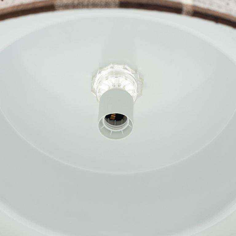 A brass and textile ceiling light. Luxus, Vittsjö.