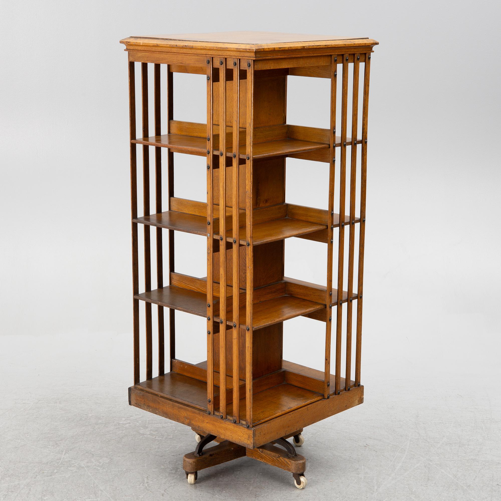 An oak Revolving bookcase by Trübner & Co, England, early 20th century.