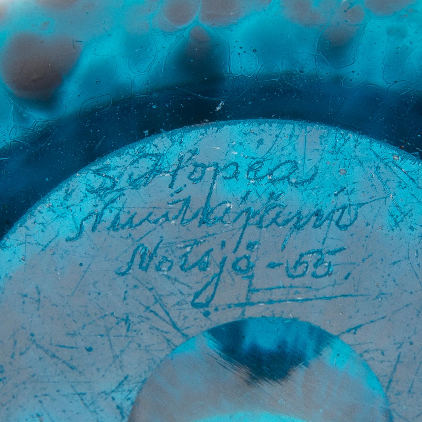 a turquoise glass vase.