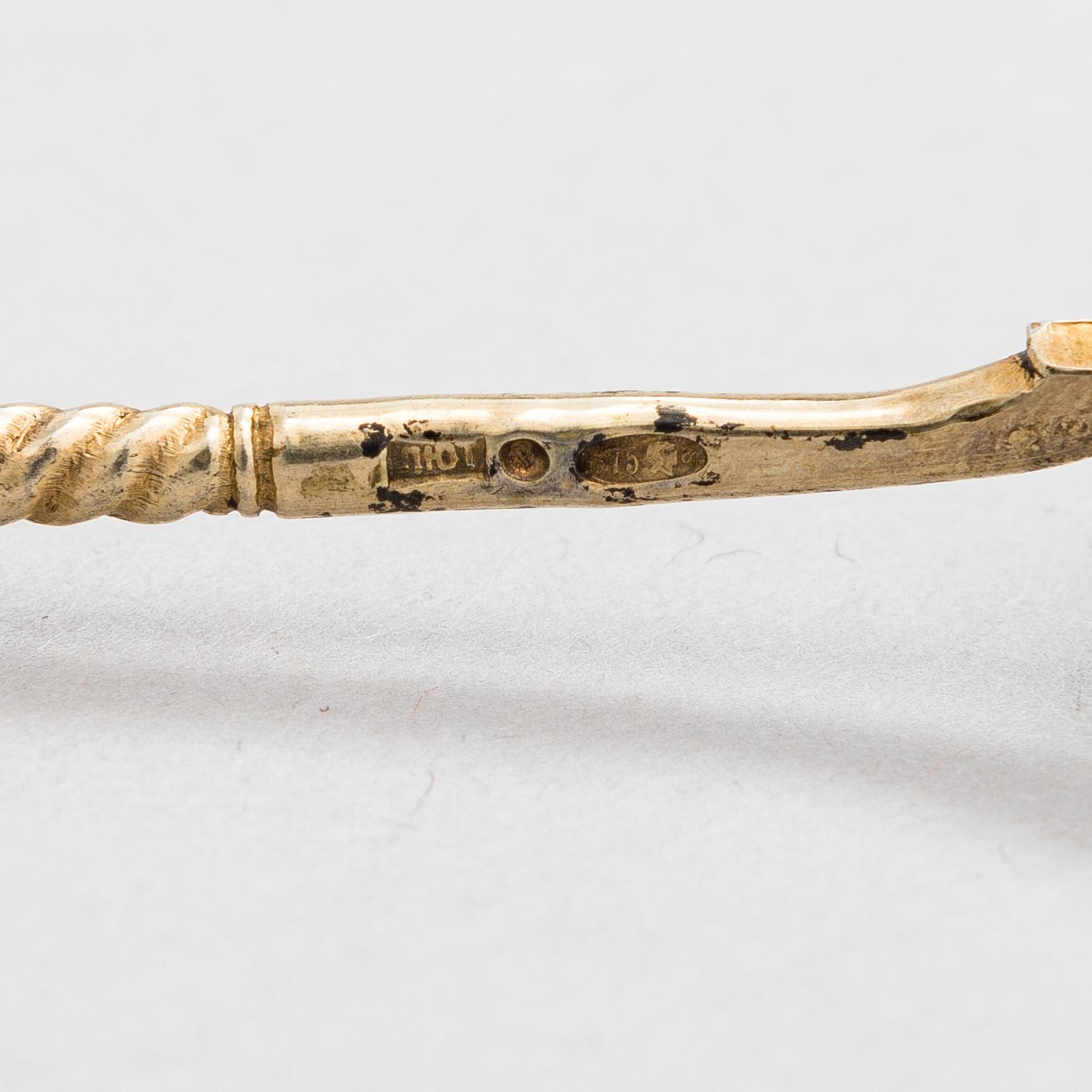 A salt cellar, mark of D. Nikitin, and 2 spoons, poss. P. Abrosimov and M. Andreyevna, enamel, silver. Moscow 1899-1908.