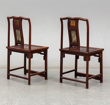 A pair of Chinese hardwood armchairs, early 20th century.