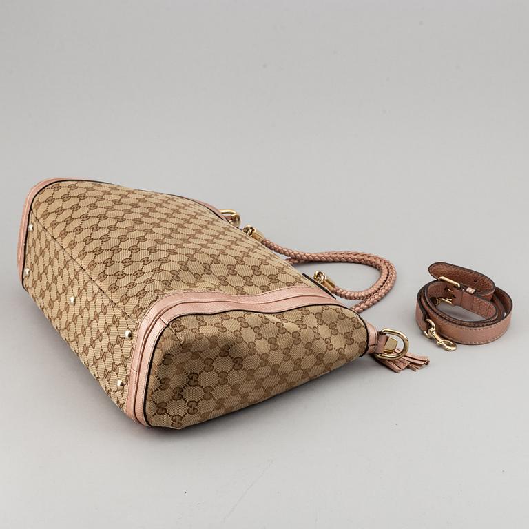 Gucci, a monogram canvas bag.