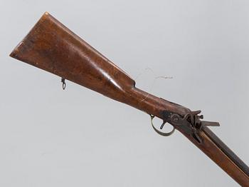 A 18/19th century flintlock rifle.