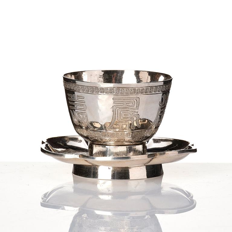 A set of six silver cups with holders, China, 20th century.