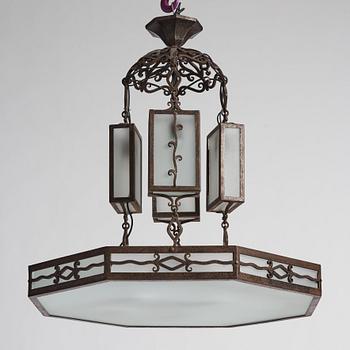 Carl Westman, attributed to, a wrought iron and frosted glass Art Nouveau chandelier, Sweden ca 1915.