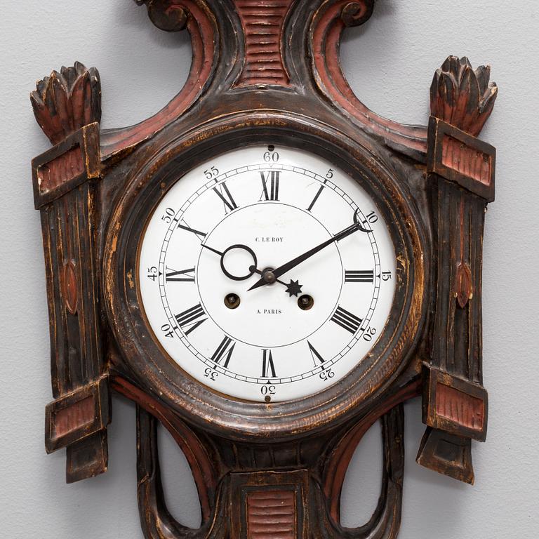 A CARVED WOOD WALL CLOCK, 19th century.