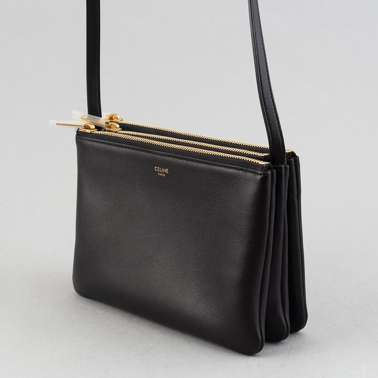Céline, a black leather 'Trio Bag'.
