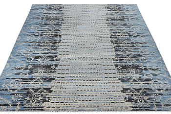 An oriental carpet, c. 302 x 244 cm.