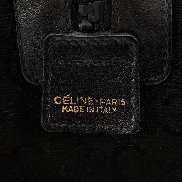 CÉLINE, a black canvas weekendbag.